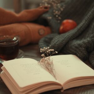 silver and diamond ring on book page